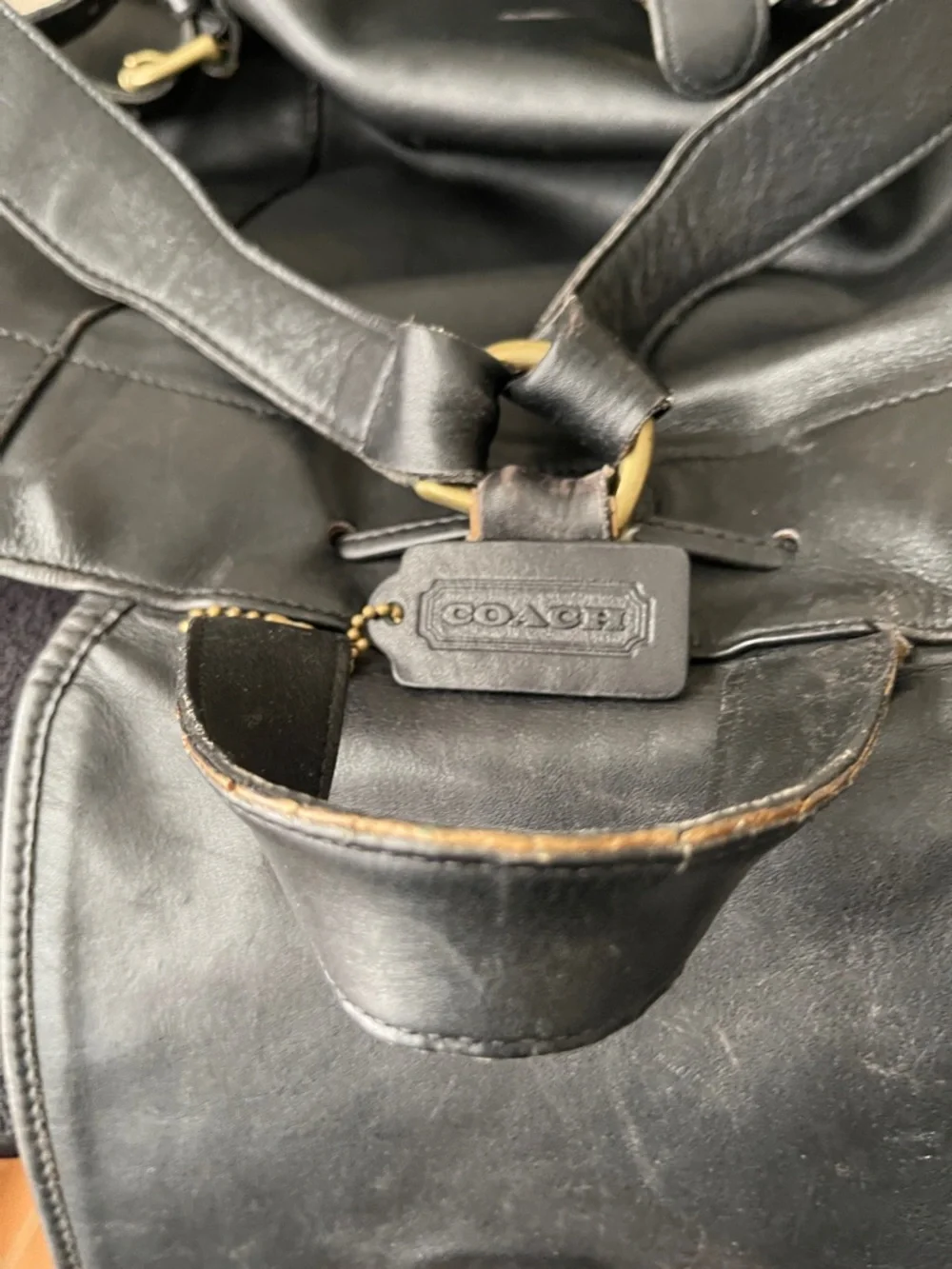 Coach Black Leather Drawstring Backpack with Front Zip Pocket